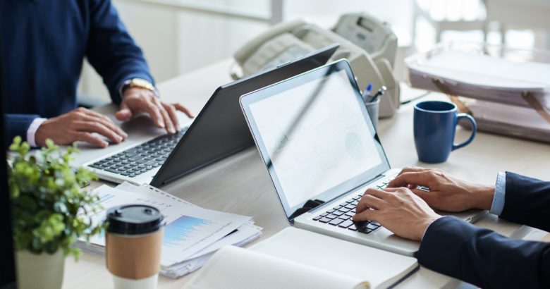 side-view-cropped-unrecognizable-business-people-working-common-desk